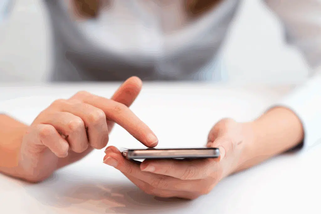 tap phone Photo Credit Canva Pro Stock Image