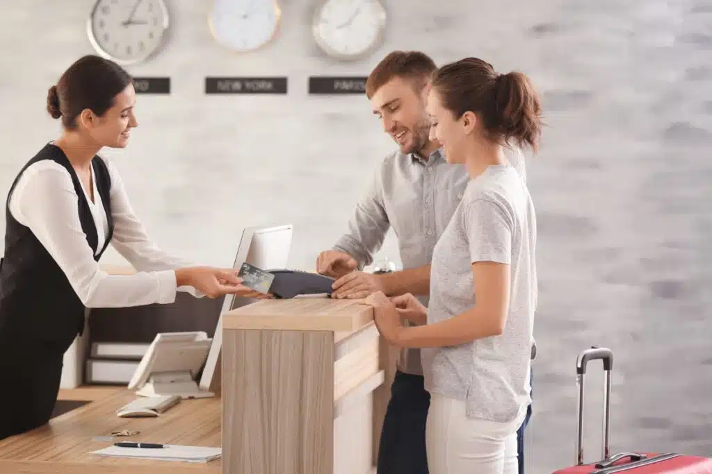 Booking hotel front desk Photo Credit Canva Pro Stock Image