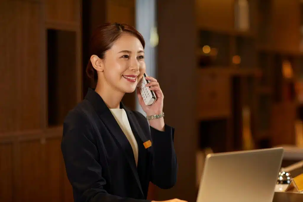 Booking hotel phone Photo Credit Canva Pro Stock Image