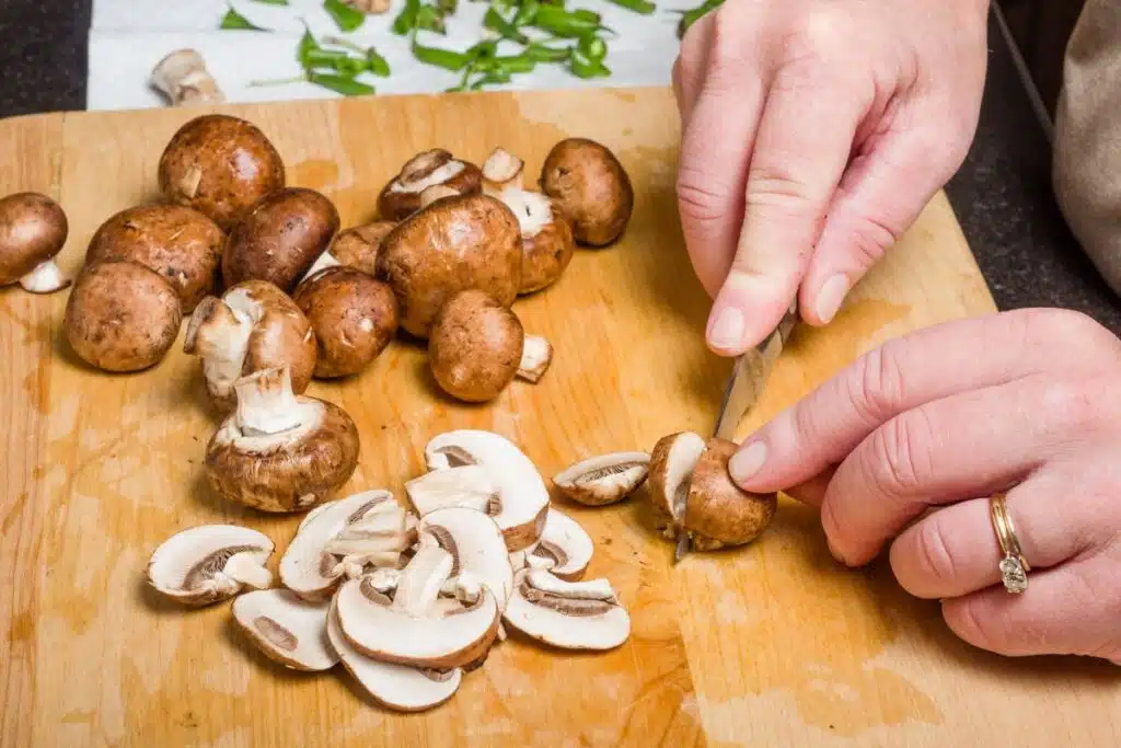 chopping mushrooms Photo Credit Canva Pro Stock Image