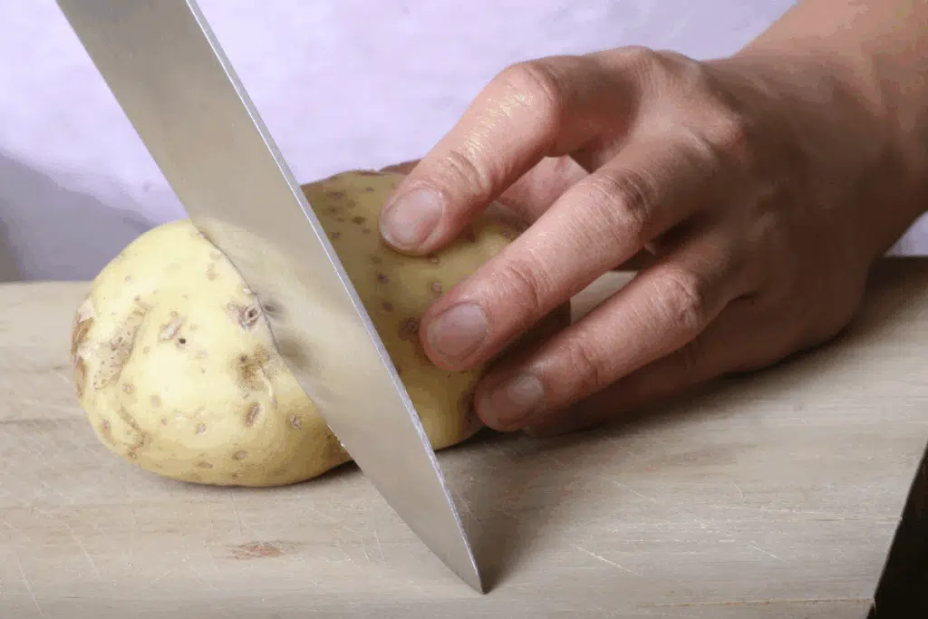 potato cutting Photo Credit Canva Pro Stock Image