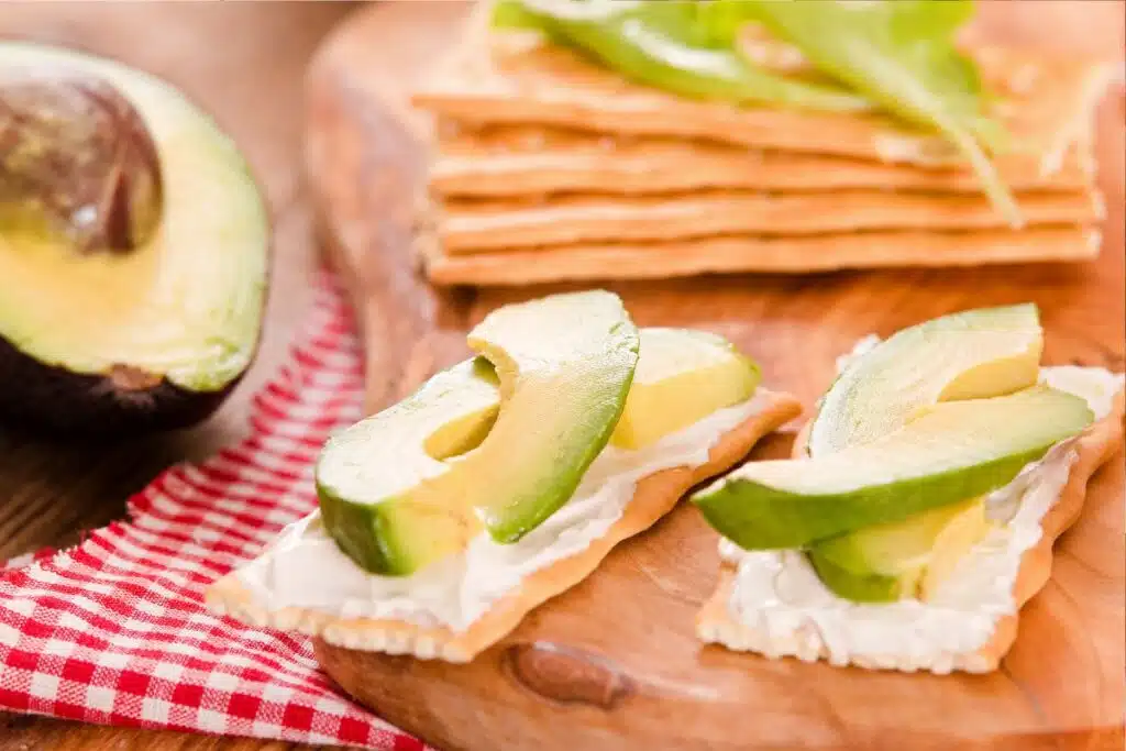 Crackers and avocado Photo Credit Canva Pro Stock Image