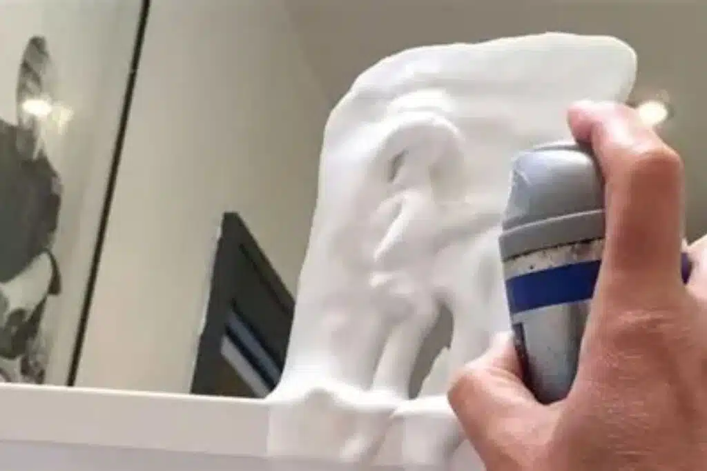 Shaving cream cleaning mirror Photo Credit OH MY Mag