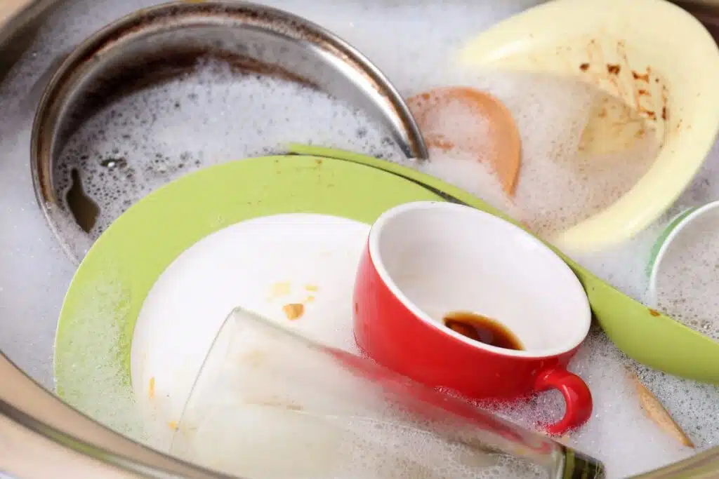 Soaking Dishes and pan sink Photo Credit Canva Pro Stock Image