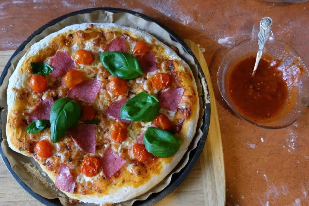 fresh herbs on pizza Photo Credit Canva Pro Stock Image