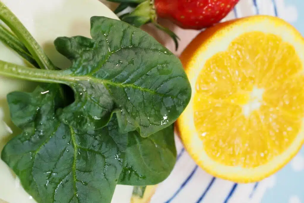 spinach and orange photo Credit Canva Pro Stock Image