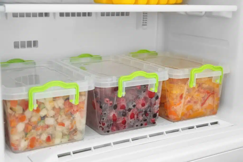 Containers in freezer Photo Credit Canva Pro Stock Image