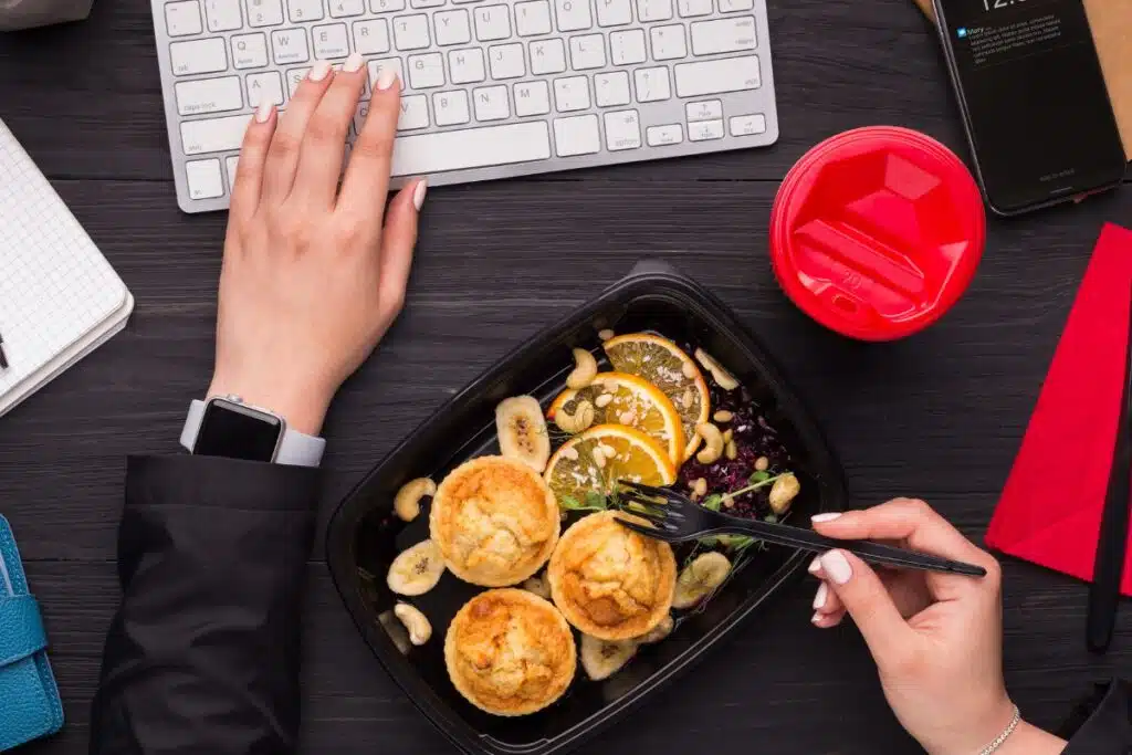 Eating lunch at Desk Photo Credit Sioux Falls Business