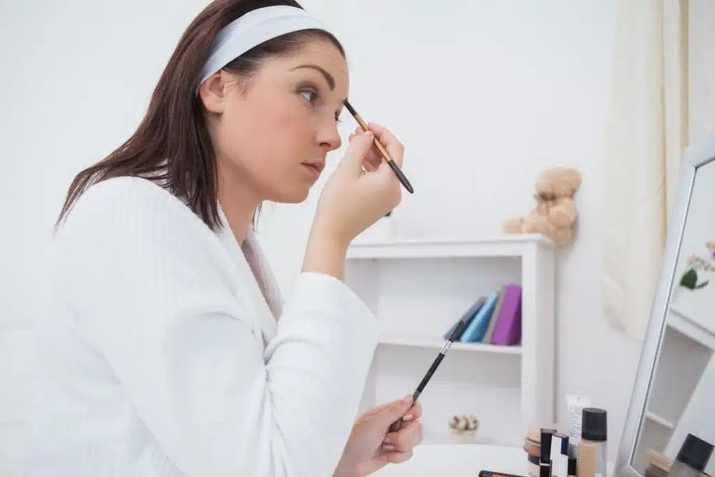 Putting on Make up Photo Credit Sioux Falls Business