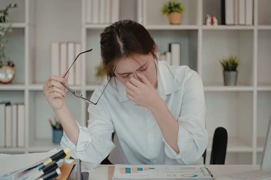 Tired at desk, work Photo Credit Canva Pro Stock Image