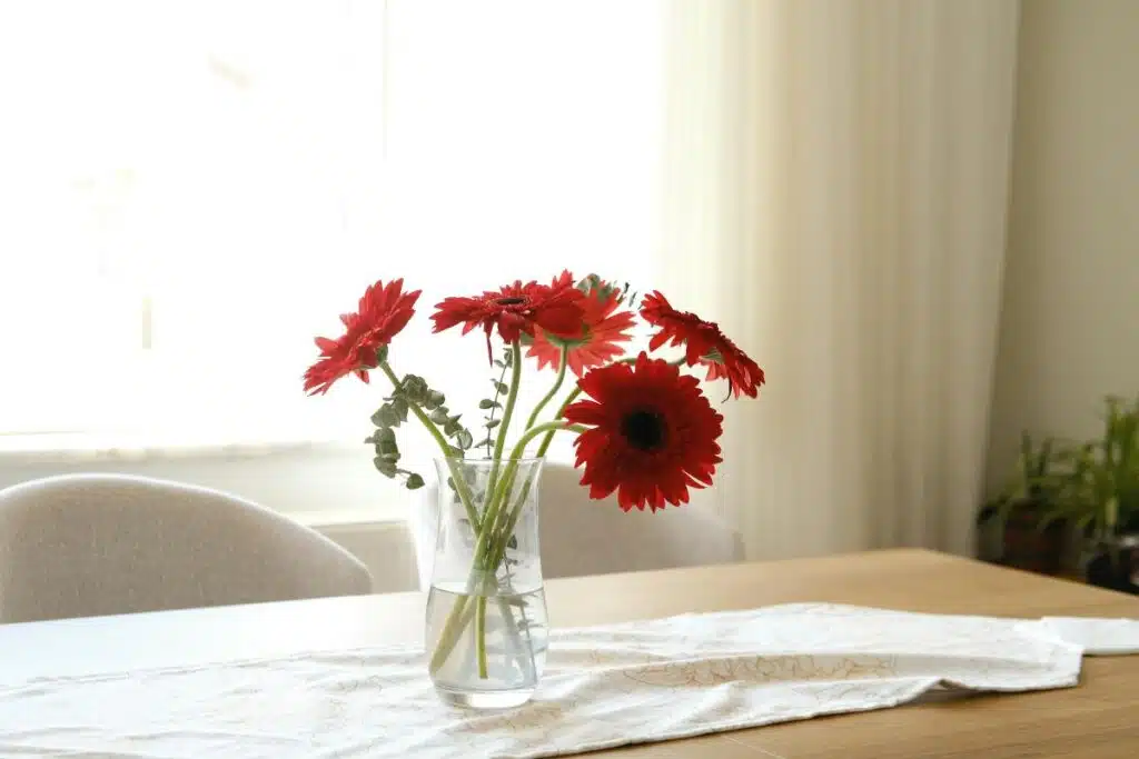 Vase with flowers and water table Photo Credit Canva Pro Stock Image