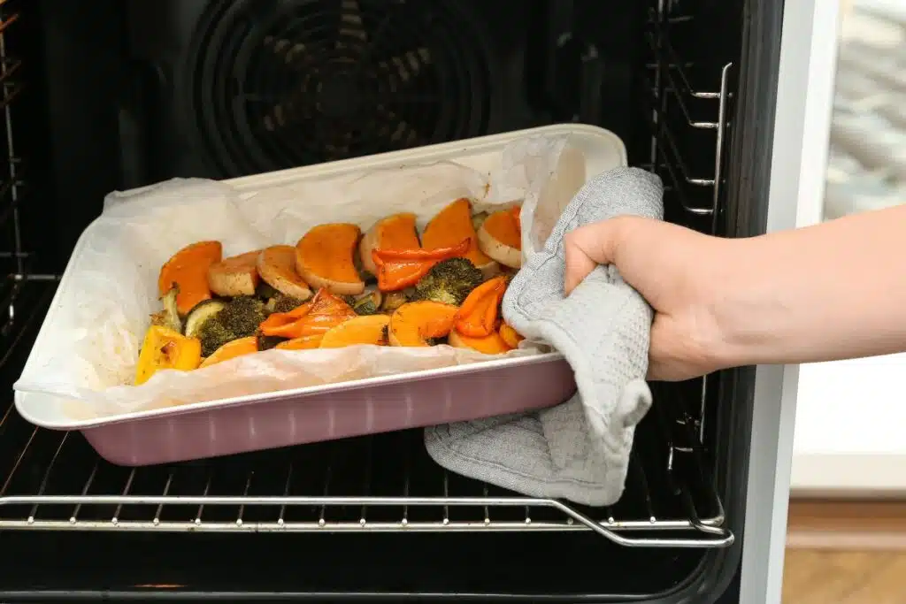 Vegetables going into oven Photo Credit Canva Pro Stock Image