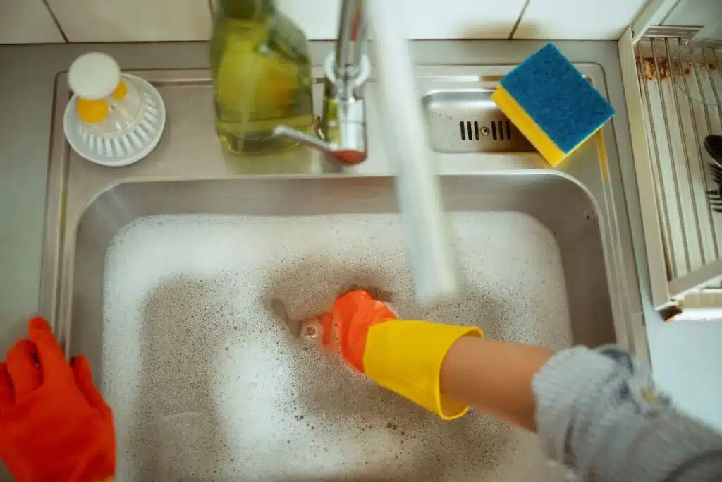 sink cleaning dishes Photo Credit Canva Pro Stock Image