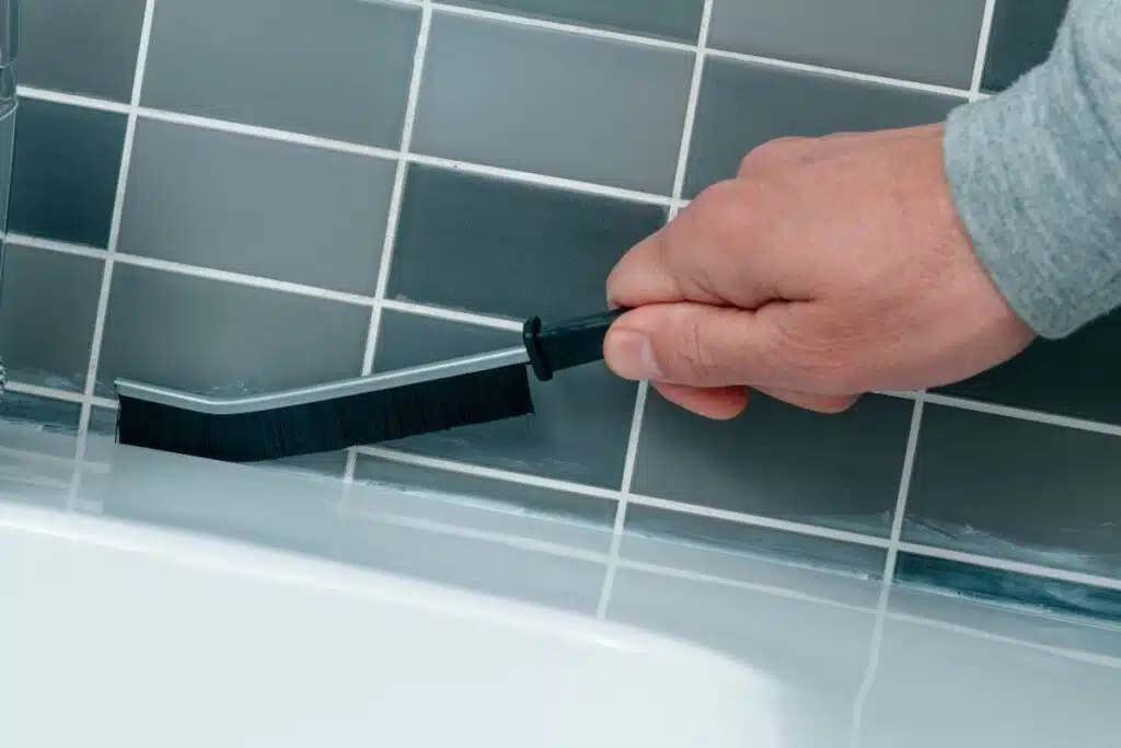 cleaning grout in Bathroom Photo Credit Canva Pro Stock Image