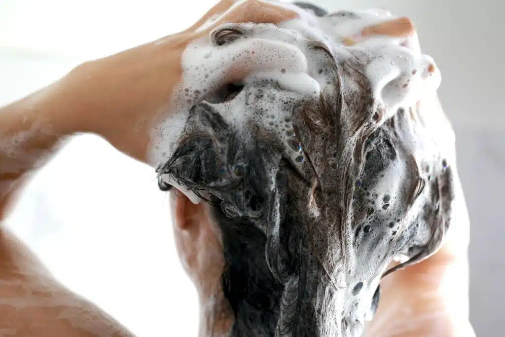 washing hair shower Photo Credit Canva Pro Stock Image