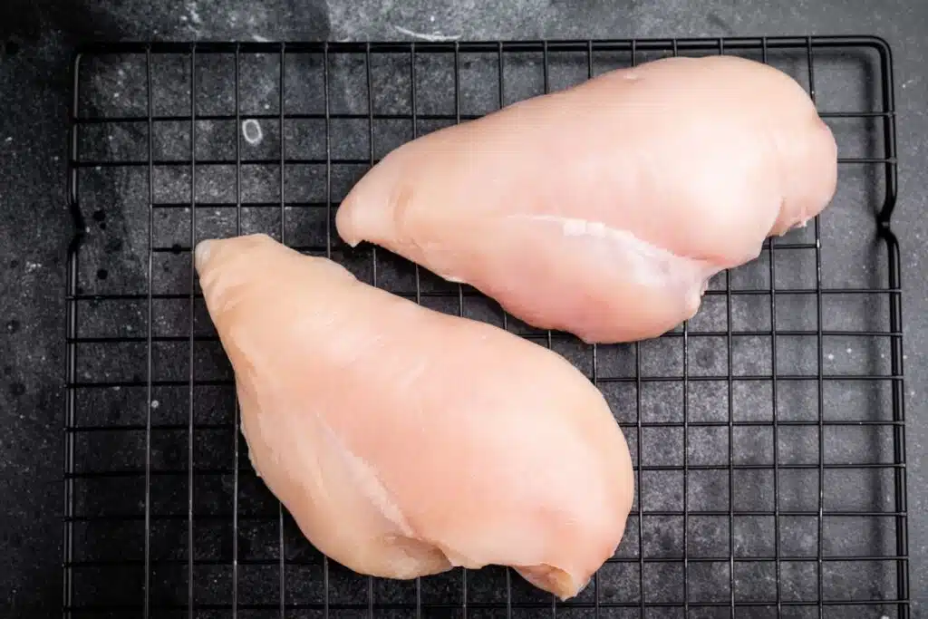 Fresh Chicken Breasts on counter Photo Credit Canva Pro Stock Image