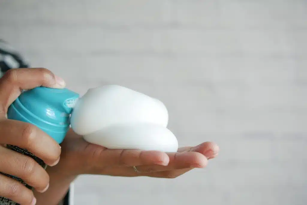 Shaving cream in hand Photo Credit Canva Pro Stock Image