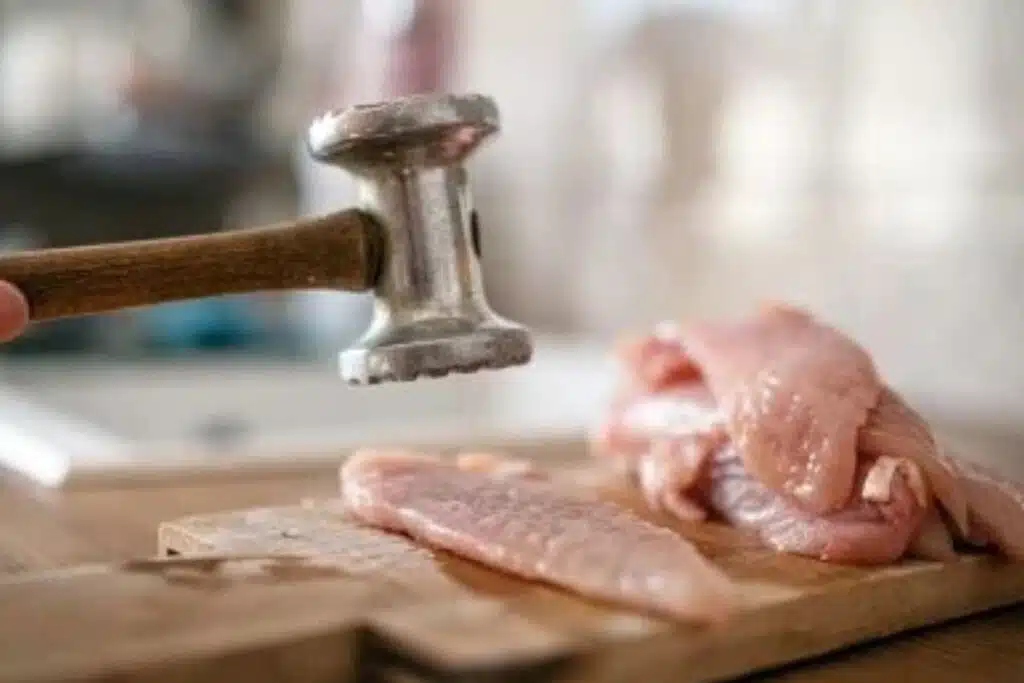 Tenderizing chicken Photo Credit Food Netword