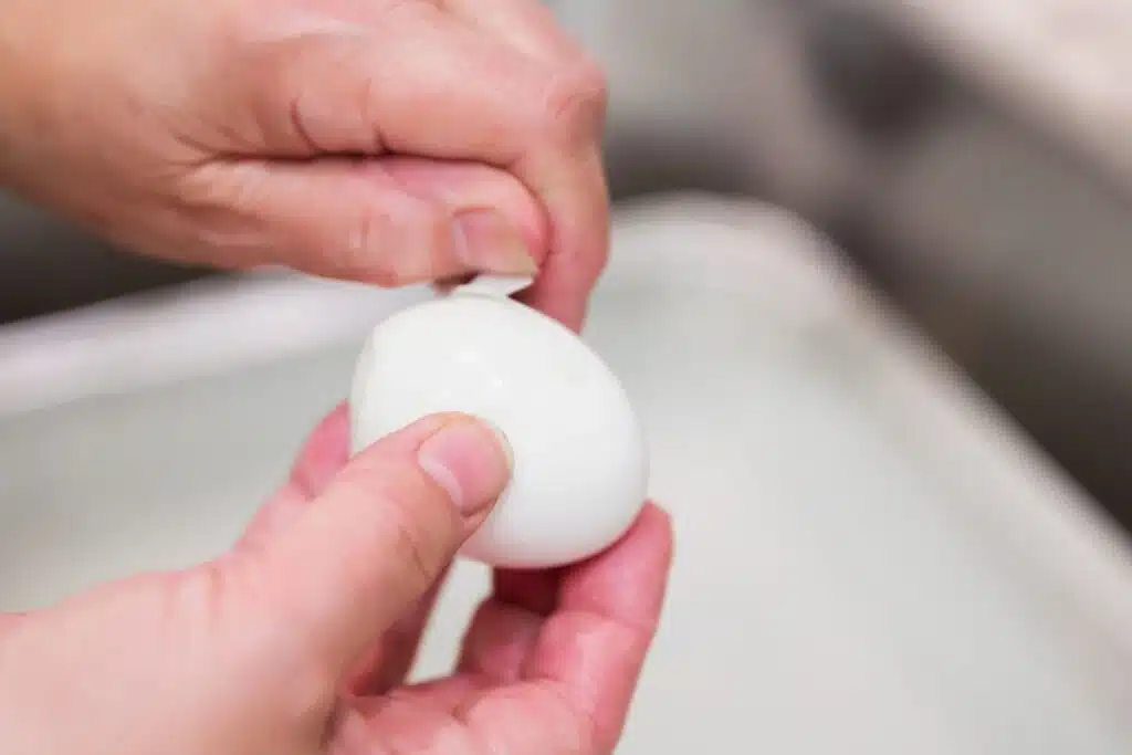 peeling eggs sink Photo Credit Canva Pro Stock Image