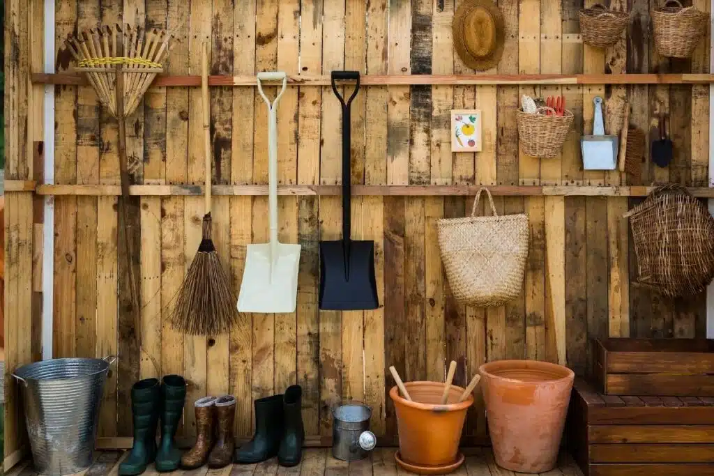 Garden tools on fence Photo Credit Canva Pro Stock Image