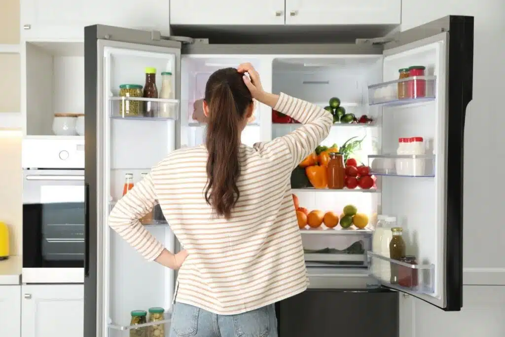 woman with Fridge door open Photo Credit Appliance Pros
