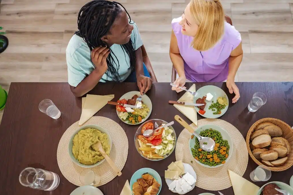 Year & Day eating at table reusable napkins Photo Credit Canva Pro Stock
